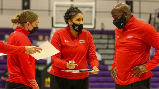 Marisa Moseley coaching and wearing a mask that reads "Black Lives Matter"