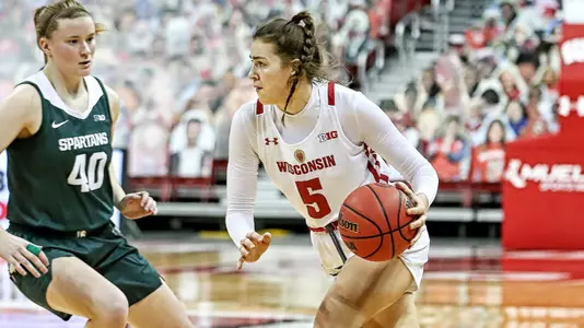 Julie Pospisilova drives around a MSU defender.