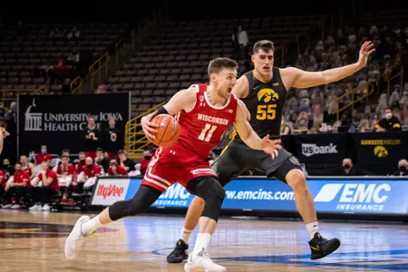 Micah Potter drives to the basket during a game at Iowa