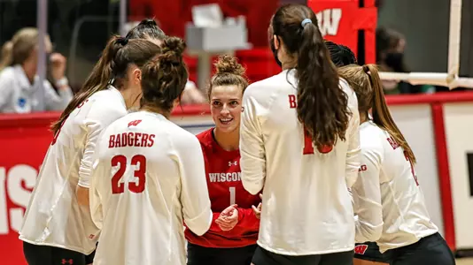 The Badger starters huddle up on the court.