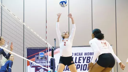 Sydney Hilley sets the ball to Devyn Robinson