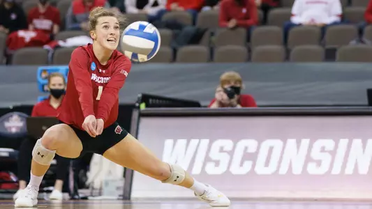 Lauren Barnes lunges to the left to dig this ball.