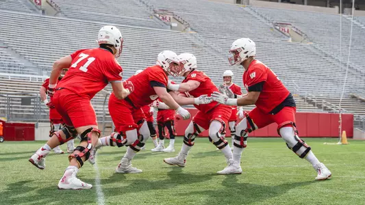 Wisconsin football offensive linemen drilling at spring practice inside Camp Randall Stadium April 2021
