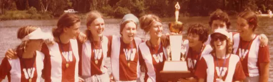 Wisconsin women's rowing - 1975 women's rowing open champions - team with coach Sue Ela and trophy