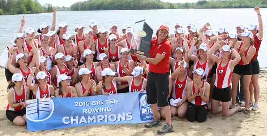 Wisconsin Women's Rowing team 2010 Big Ten Champions team photo with coach Bebe Bryans holding trophy