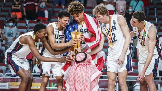 Jonathan Davis accepts the FIBA U19 World Cup Trophy with teammates