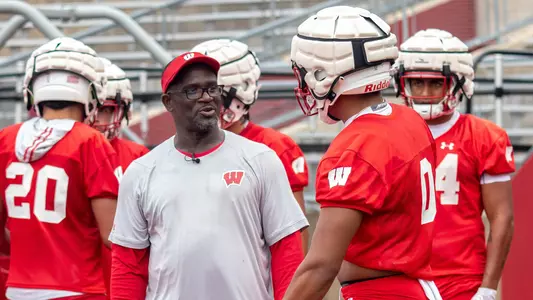 Wisconsin football assistant coach - running backs Gary Brown talks to running back Braelon Allen at practice