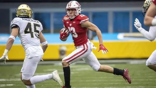 Wisconsin Badgers wide receiver Chimere Dike (13) carries the ball during an NCAA college football game at the Duke’s Mayo Bowl against the Wake Forest Demon Deacons Wednesday, Dec. 30, 2020, in Charlotte, NC. The Badgers won 42-28. (Photo by David Stluka/Wisconsin Athletic Communications)