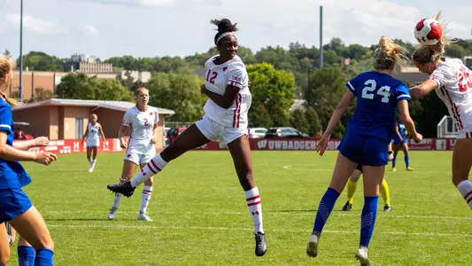 Joyelle Washington (12) heads the ball against Eastern Illinois