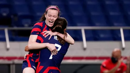 Jul 24, 2021; Saitama, Japan; Team United States midfielder Rose Lavelle (16) celebrates with forward Tobin Heath (7) after scoring a goal during the first half against New Zealand in group G play during the Tokyo 2020 Olympic Summer Games at Saitama Stadium. Mandatory Credit: Jack Gruber-USA TODAY Network