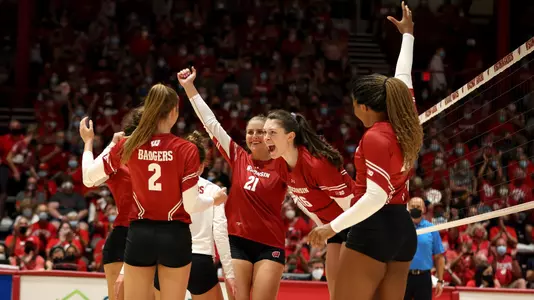 The Badgers celebrate a point on the UW Field House court.