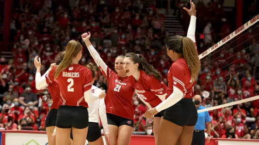 The Badgers celebrate a point on the UW Field House court.