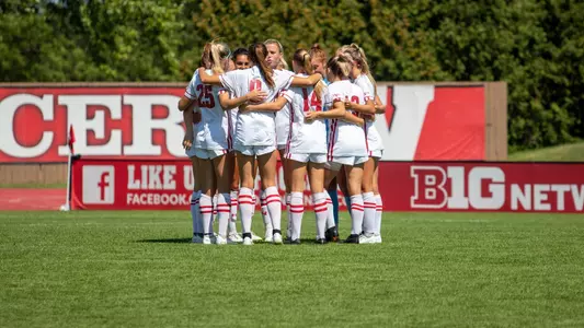 Badgers huddle vs. Eastern Illinois