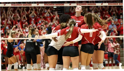 The Badgers celebrate on the court vs. Kentucky