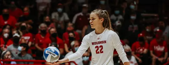 Julia Orzol, Wisconsin volleyball, prepares to serve the ball in a match at the UW Field House.