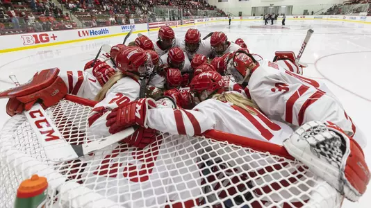 Wisconsin BadgersWisconsin Badgers huddle prior to an NCAA women’s college ice hockey game against the Ohio State Buckeyes, Sunday, Oct. 24, 2021, in Madison, Wis. The Badgers won 2-1 in overtime. (Photo by David Stluka/Wisconsin Athletic Communications)