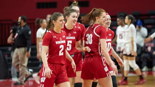 Wisconsin players smile after defeating Rutgers