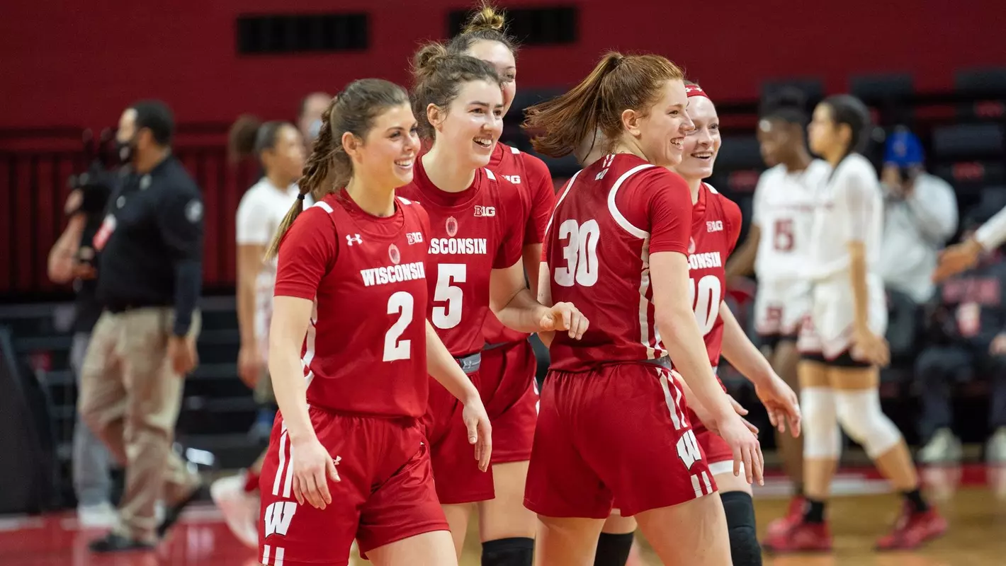 Wisconsin players smile after defeating Rutgers