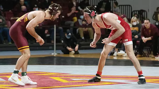 Garrett Model wrestles Minnesota opponent Brayton Lee on Sunday, January 16, 2022. Model won 10-5 decision over Lee and Wisconsin defeated Minnesota 21-15 at Maturi Pavilion in Minneapolis.