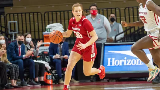 Sydney Hilliard brings the ball up the court.