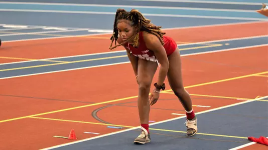 Diamond Black prepares to run down the long jump runway.