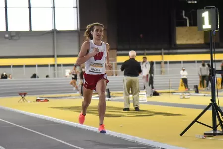 Olin Hacker wins the mile at Iowa.