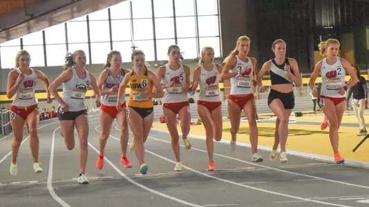 Five Badgers compete at the start of the mile at Iowa.