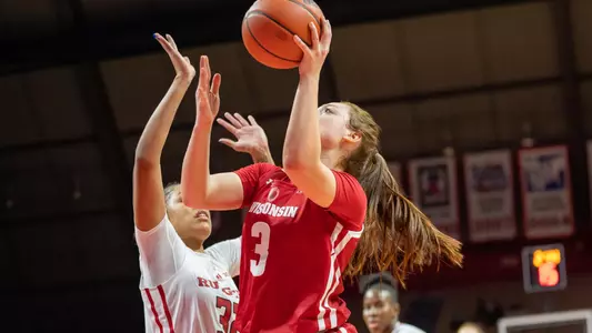 Brooke Schramek shoots under the basket against a Rutgers defender.