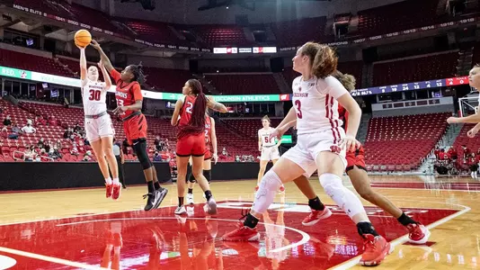 Sydney Hilliard drives to the basket while Brooke Schramek waits for the rebound.