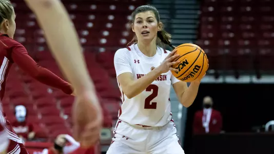 Katie Nelson looks to pass the ball.