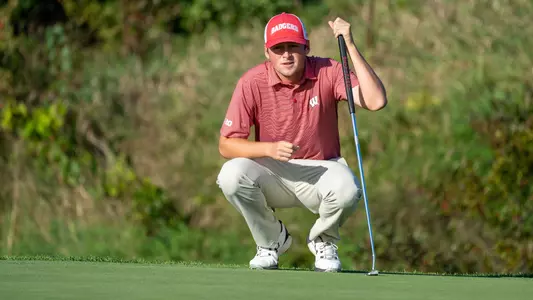 Coalter Smith, Wisconsin men's golf, eyes up the hole at the 2022 Badger Invitational at University Ridge Golf Course in Madison, Wis., on Tuesday, Sept. 13, 2022.