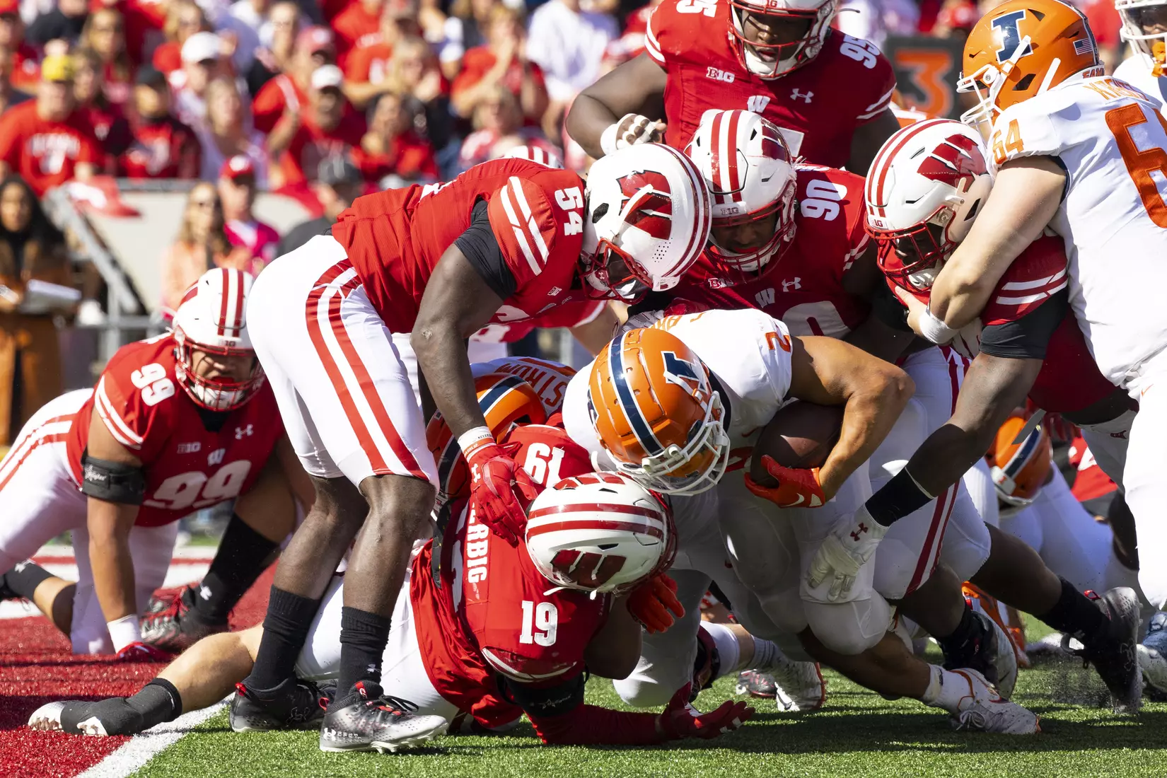 A herd of Wisconsin Badgers put a stop on the Illinois offense as the attempt to score during an NCAA football game October 1, 2022 in Madison, WI.Photo by Tom Lynn/Wisconsin Athletic Communications