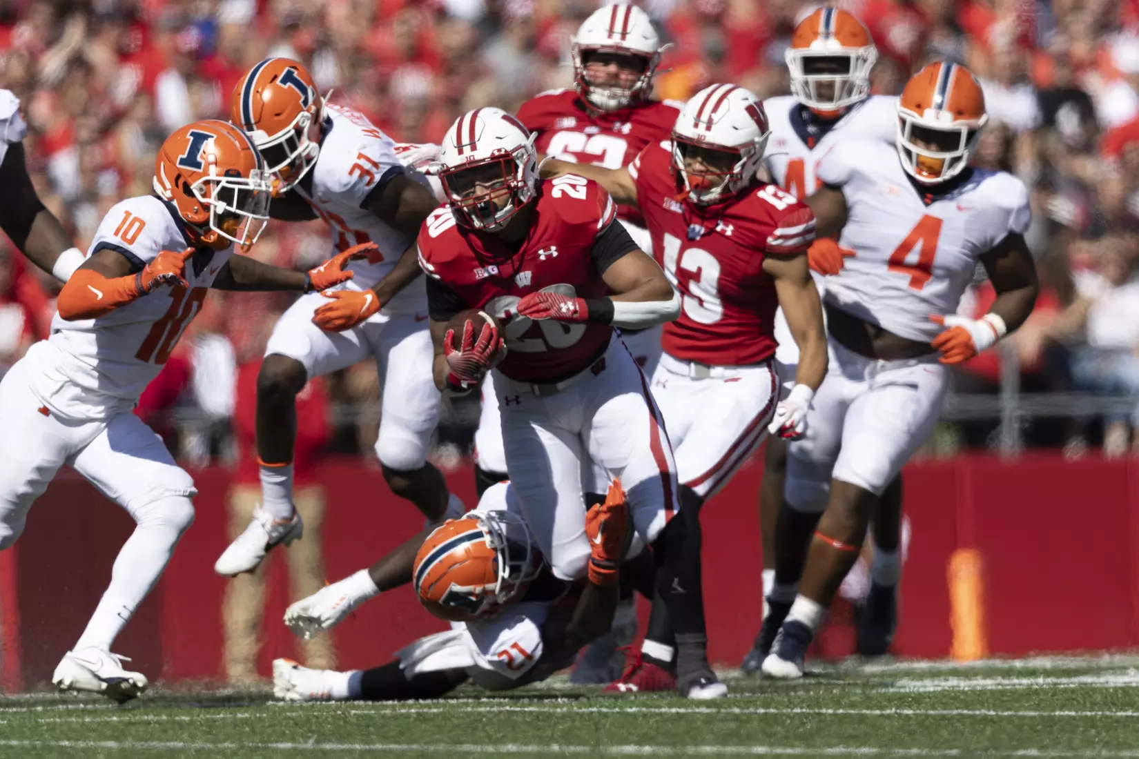 Wisconsin Badgers running back Isaac Guerendo carries the ball through a herd of Illini during an NCAA football game against the University of Illinois October 1, 2022 in Madison, WI.Photo by Tom Lynn/Wisconsin Athletic Communications