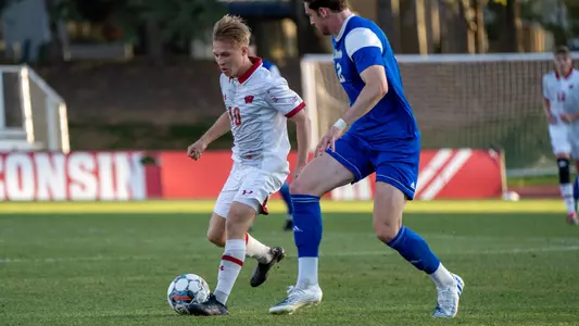 Tim Bielic takes on a Drake defender