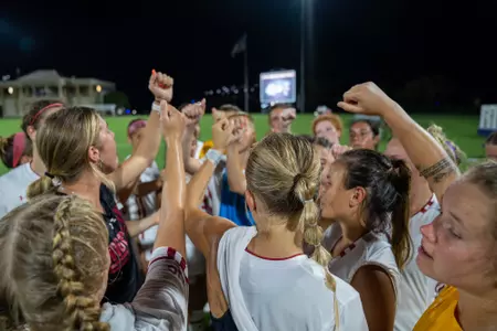 Team breakdown in a huddle after game