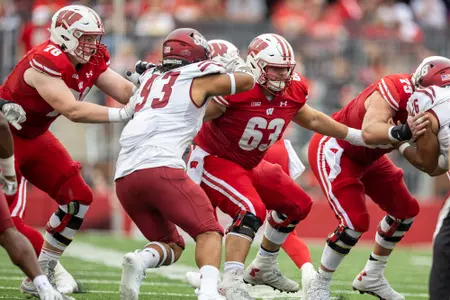 Wisconsin Badgers offensive lineman Tanor Bortolini (63) blocks during an NCAA college football game against the New Mexico State Aggies, Saturday, Sept. 17, 2022, in Madison, Wis. The Badgers won 66-7. (Photo by David Stluka/Wisconsin Athletic Communications)