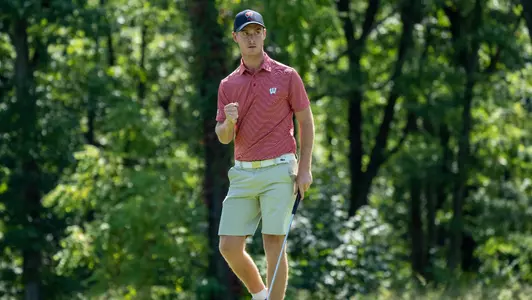 Maxime Legros of Wisconsin men's golf celebrates after a put at the 2022 Badger Invitational