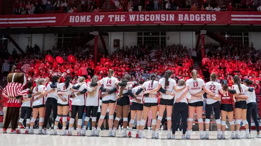 The Badgers sing "varsity" in front of the student section.