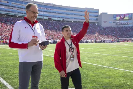 Wisconsin Badgers Athletic Director Chris McIntosh, left, with wrestler Austin Gomez during an NCAA college football game against the Illinois Fighting Illini, Saturday, Oct. 1, 2022 in Madison, Wis. The Illini won 34-10. (Photo by David Stluka/Wisconsin Athletic Communications)