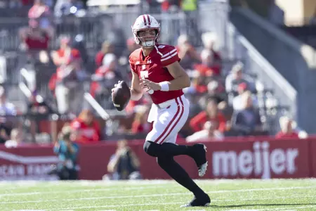 Wisconsin football quarterback Graham Mertz runs down field as The Wisconsin Badgers face Illinois during an NCAA football game October 1, 2022 in Madison, WI.Photo by Tom Lynn/Wisconsin Athletic Communications