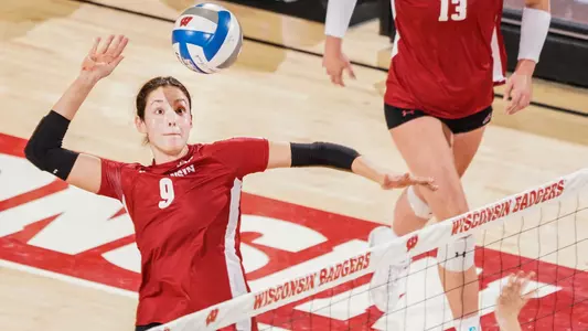 Caroline Crawford has her eyes on the ball as she goes up to hit.
