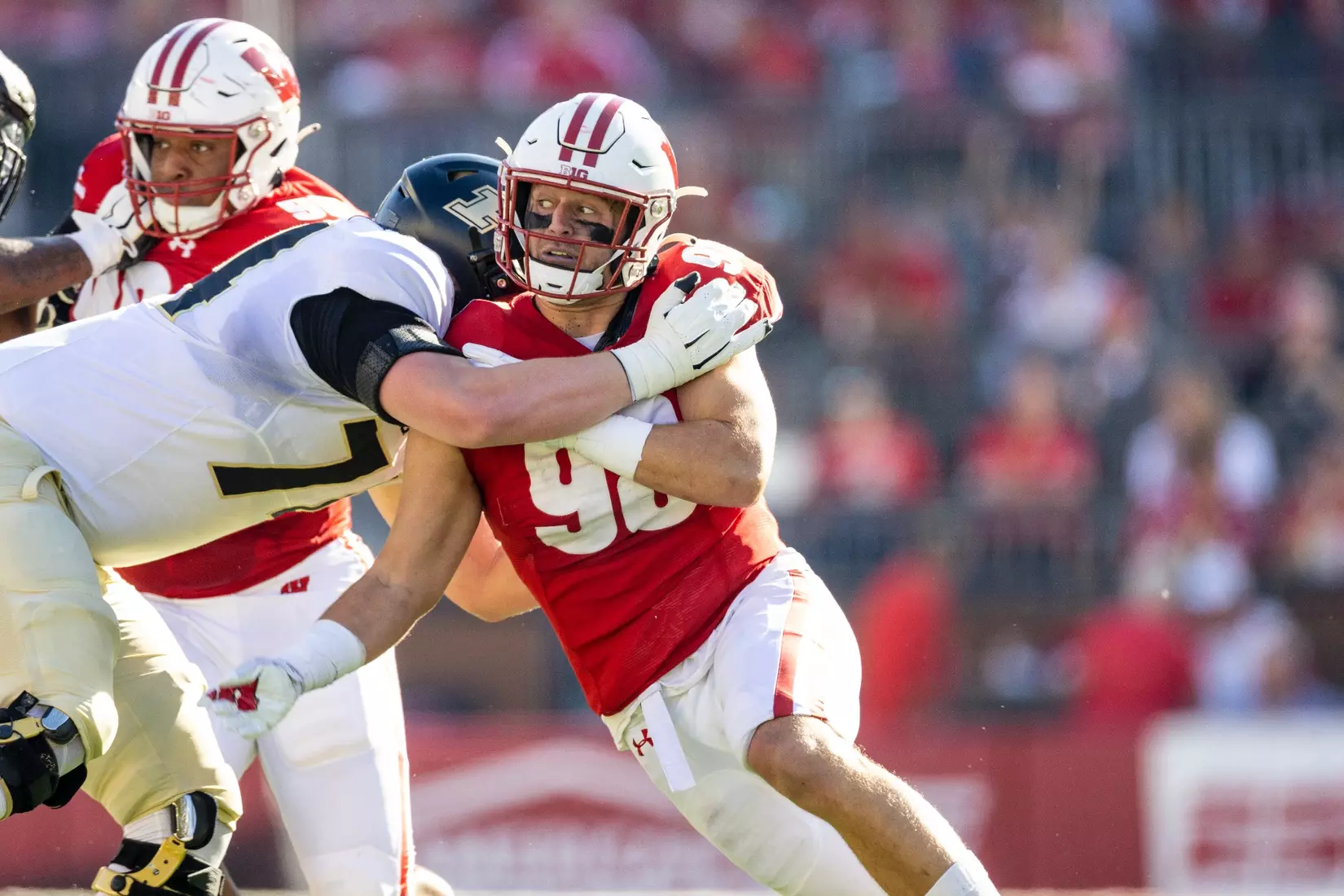 Wisconsin Badgers outside linebacker C.J. Goetz (98) fighting past the Boilmakers offensive line during an NCAA college football game against the Purdue Boilermakers, Saturday, Oct. 22, 2022 in Madison, Wis.