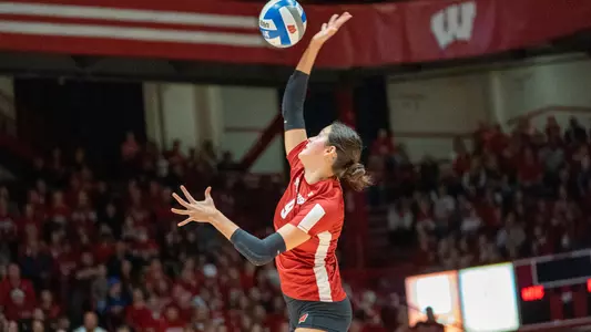 Caroline Crawford serves up the ball.