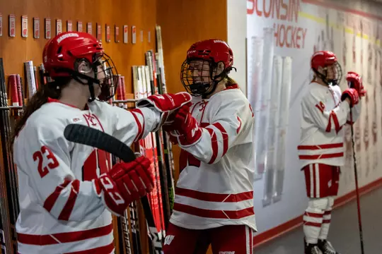 Wisconsin Badgers' forward Jesse Compher (7) and Sarah Wozniewicz (23) fist bump before an NCAA womenÃ?s hockey match against Lindenwood on Thursday September 29, 2022 in Madison, Wisconsin.Photo by Tom Lynn/Wisconsin Athletic Communications