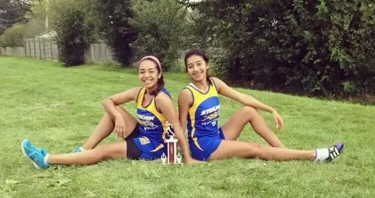 Estafania Zavala, DAT, Wisconsin sports medicine athletic trainer in high school cross country with friend