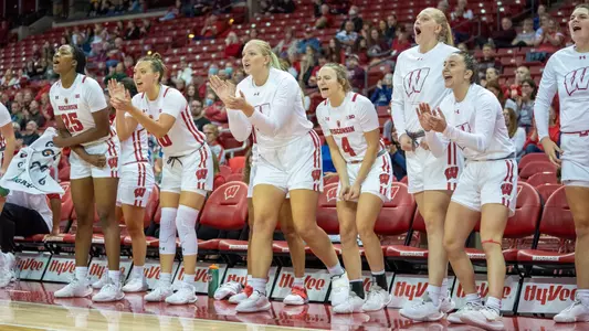 The women's basketball bench cheering