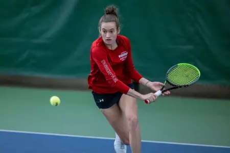Ava Markham runs forward to return the ball during a match