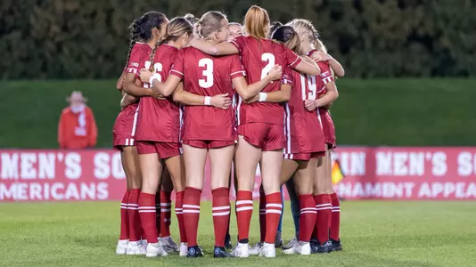 Wisconsin huddles on field to discuss game plan