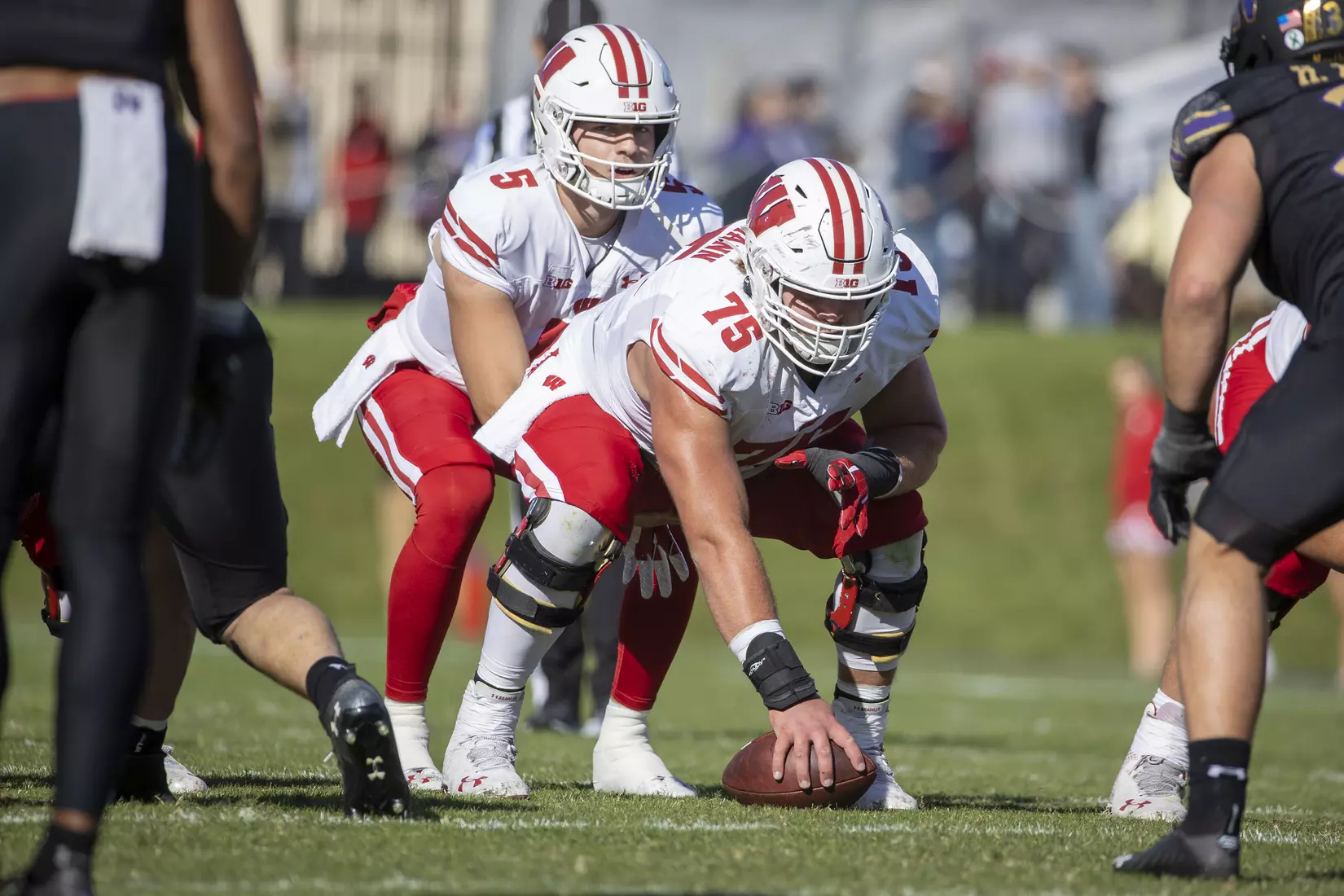 Wisconsin Badgers quarterback Graham Mertz (5) and center Joe Tippman (75) during an NCAA Big Ten Conference college football game against the Northwestern Wildcats on Saturday, Oct. 8, 2022, in Evanston, Ill. The Badgers defeated the Wildcats, 42-7.