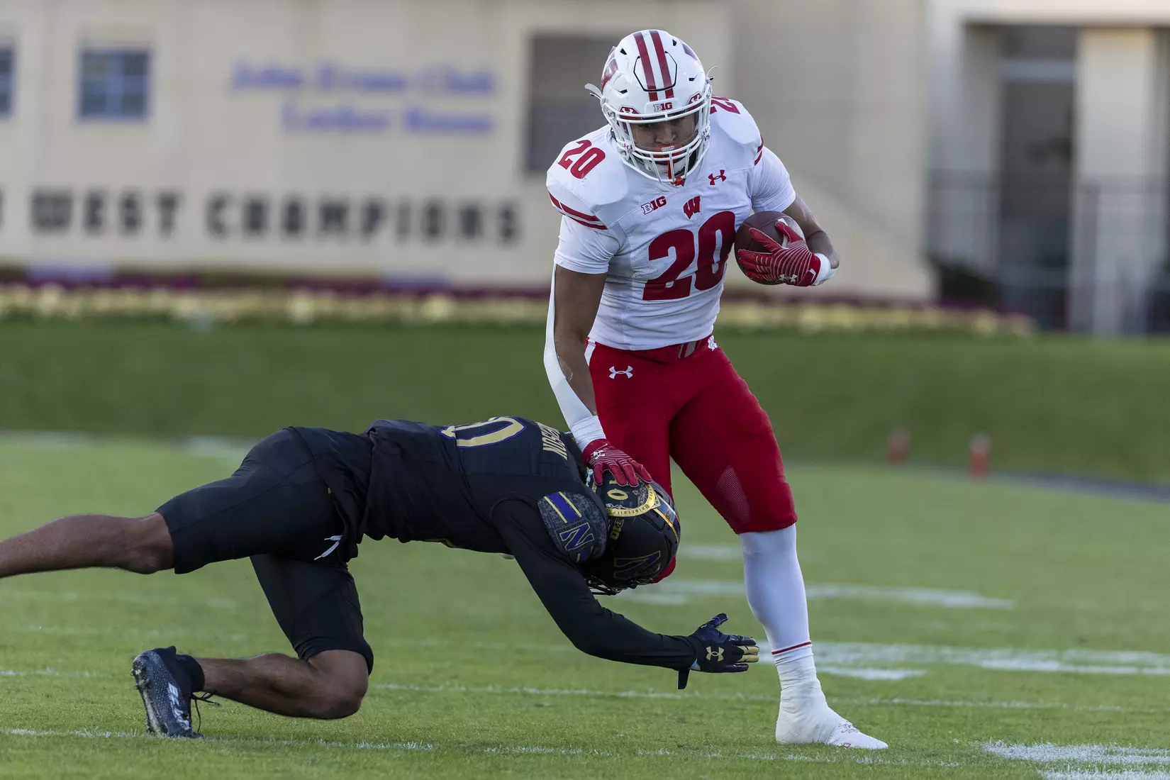 Wisconsin Badgers running back Isaac Guerendo (20) runs the ball during an NCAA Big Ten Conference college football game against the Northwestern Wildcats on Saturday, Oct. 8, 2022, in Evanston, Ill. The Badgers defeated the Wildcats, 42-7.